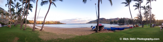 Panorama of the palm-lined Kalapaki Beach in Nawiliwili Harbor on Kauai, Hawaii.