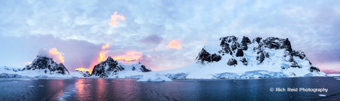 Stunning panoramic sunset in the Lemaire Channel, Antarctica.